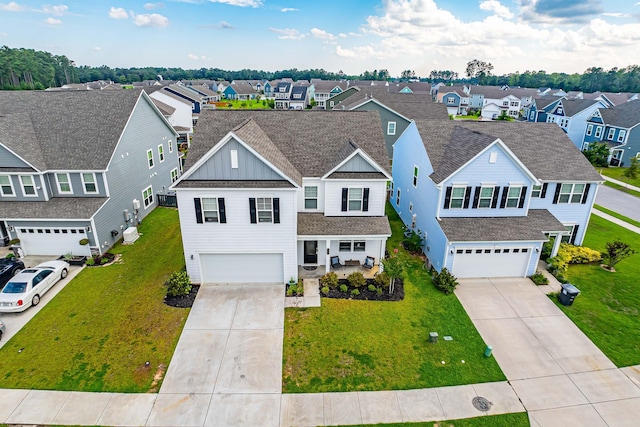 view of front of home featuring a garage and a front yard