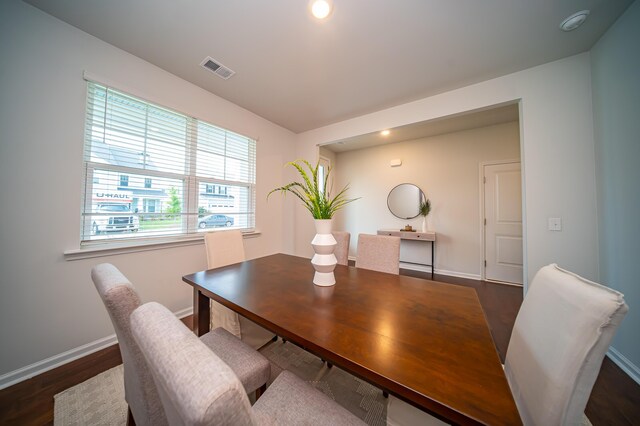 dining area with dark wood-type flooring