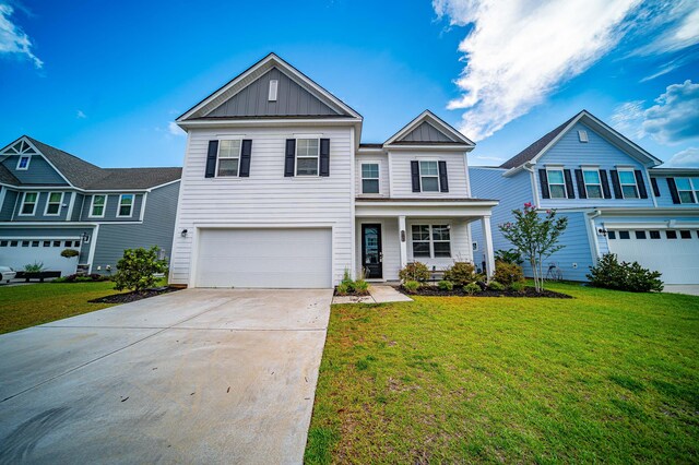 view of front of house featuring a garage and a front lawn