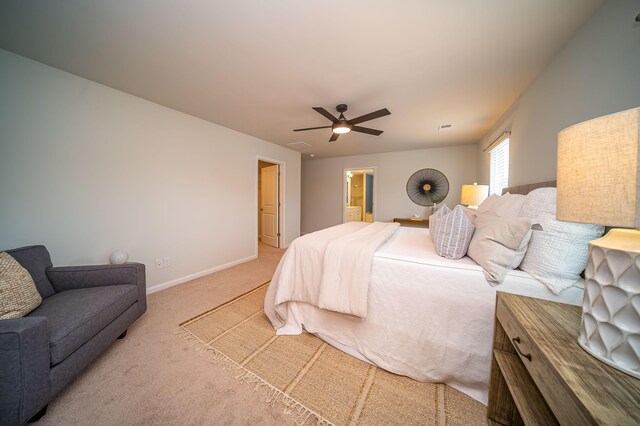 bedroom featuring carpet, connected bathroom, and ceiling fan