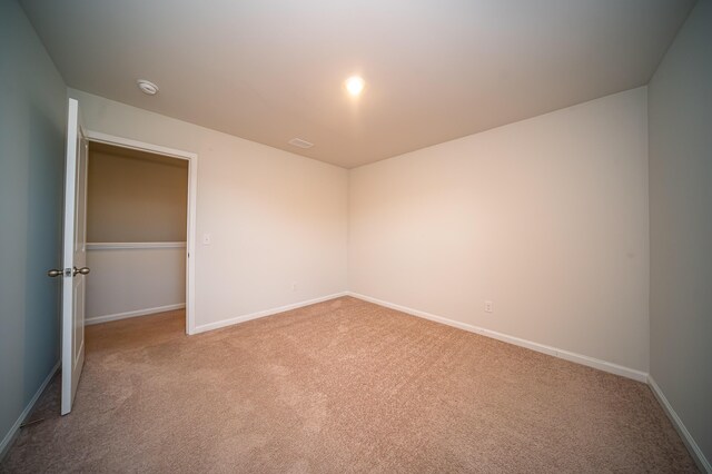 unfurnished bedroom with light carpet