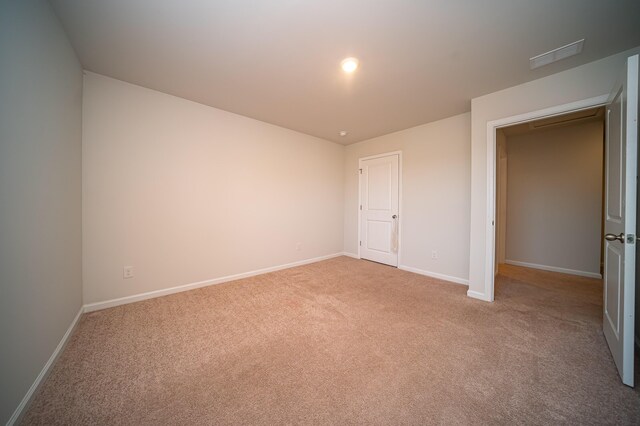 unfurnished bedroom with light carpet