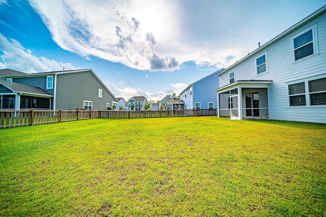 view of yard with a sunroom