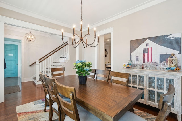 dining room with an inviting chandelier, baseboards, stairway, and wood finished floors