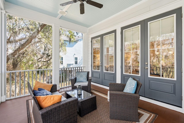 sunroom / solarium with a ceiling fan