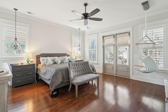 bedroom with ornamental molding, dark wood finished floors, visible vents, and baseboards