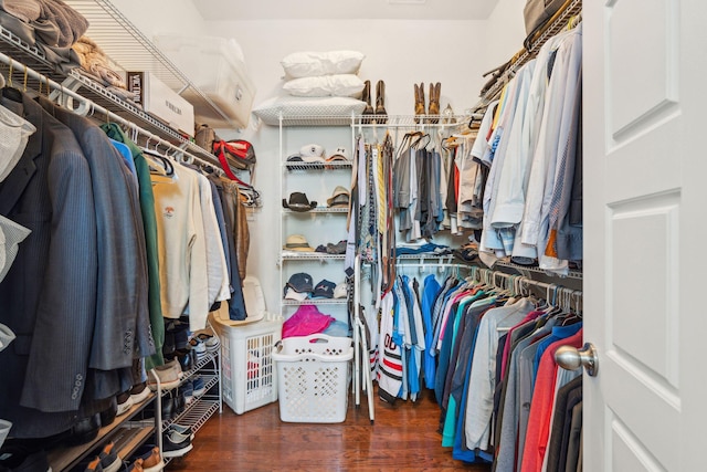 walk in closet featuring wood finished floors