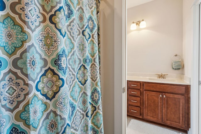 full bath featuring vanity and a shower with curtain