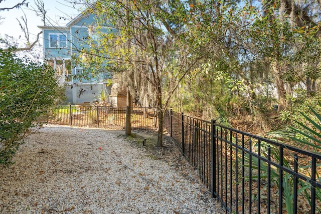 view of gate featuring fence