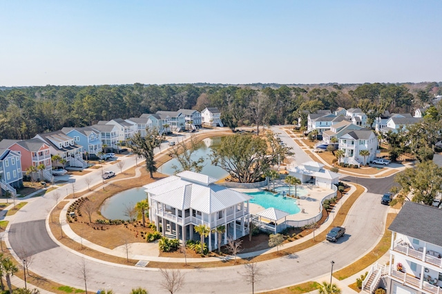 bird's eye view featuring a water view and a residential view