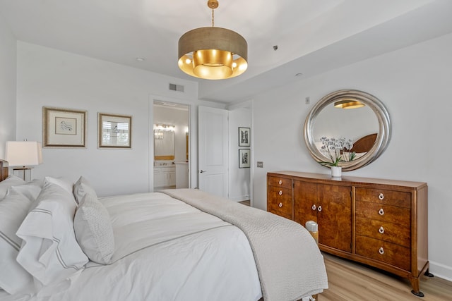 145 Pier View St Unit 407, Charleston, SC 29492 - bedroom featuring light wood finished floors and connected bathroom