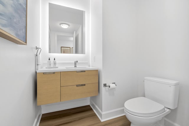 145 Pier View St Unit 407, Charleston, SC 29492 - bathroom with baseboards, toilet, vanity, and wood finished floors