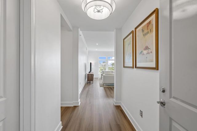 145 Pier View St Unit 407, Charleston, SC 29492 - hallway featuring wood finished floors, a chandelier, baseboards, and recessed lighting