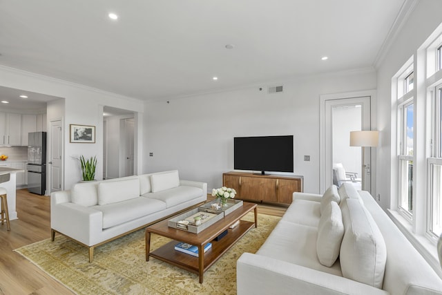 145 Pier View St Unit 407, Charleston, SC 29492 - living room featuring light wood-style floors, ornamental molding, and recessed lighting