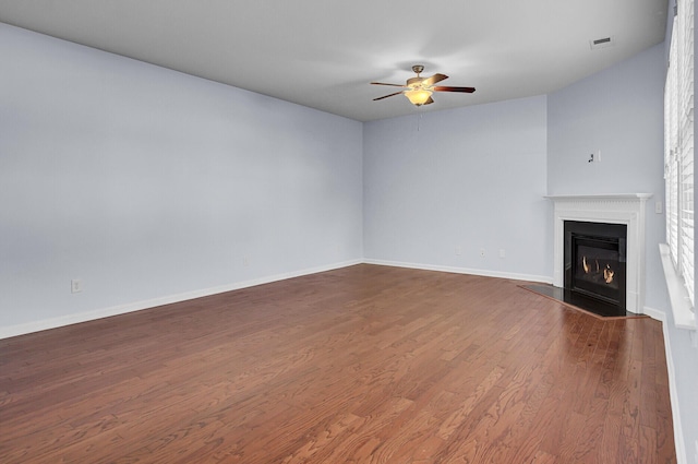 123 Blackwater Way, Moncks Corner, SC 29461 - unfurnished living room featuring ceiling fan, dark wood-type flooring, and a fireplace with flush hearth