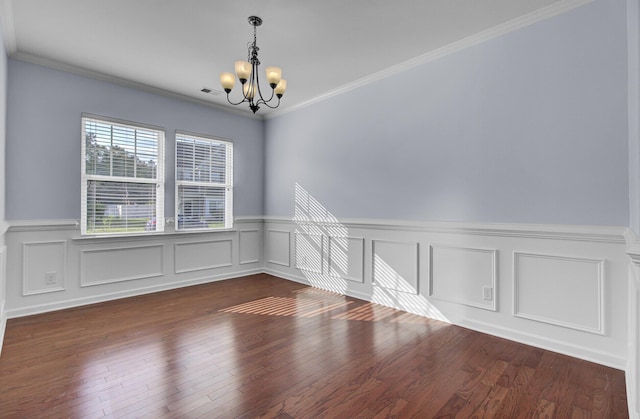 123 Blackwater Way, Moncks Corner, SC 29461 - unfurnished room with a chandelier, a wainscoted wall, dark wood finished floors, ornamental molding, and a decorative wall