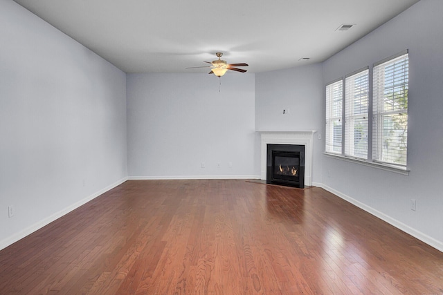 123 Blackwater Way, Moncks Corner, SC 29461 - unfurnished living room featuring ceiling fan, a fireplace with flush hearth, and dark wood finished floors