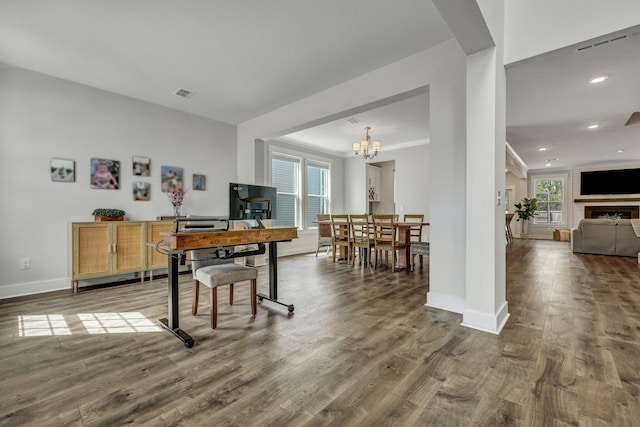 dining room with visible vents, baseboards, recessed lighting, wood finished floors, and a notable chandelier