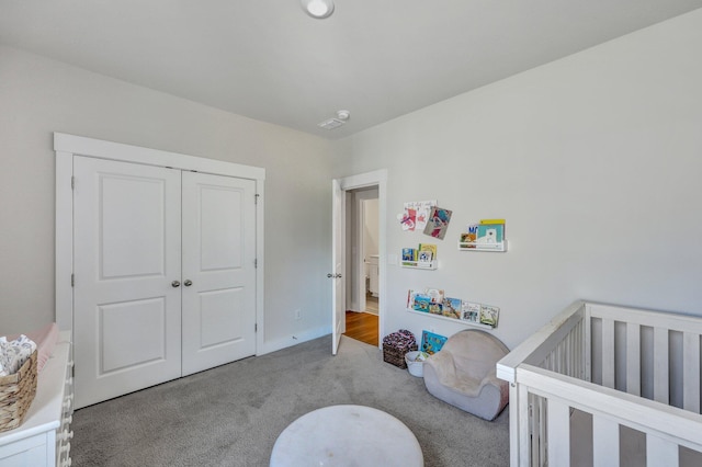 carpeted bedroom with a closet