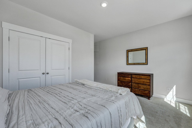 carpeted bedroom featuring a closet