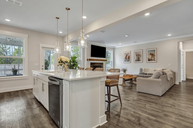 kitchen with visible vents, open floor plan, a fireplace, dark wood-style floors, and white cabinets