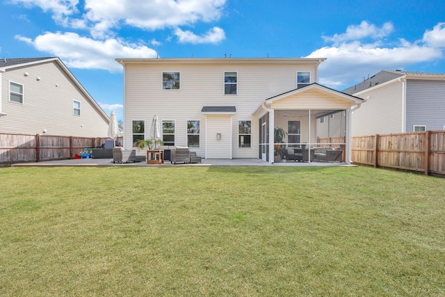 back of property with a fenced backyard, a lawn, a patio, and a sunroom