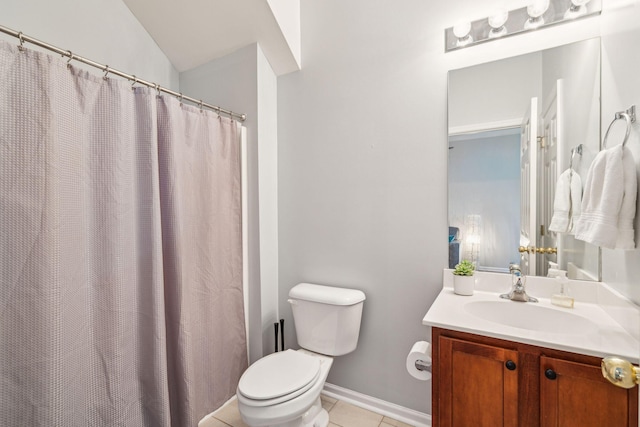 bathroom featuring vanity, baseboards, lofted ceiling, tile patterned flooring, and toilet