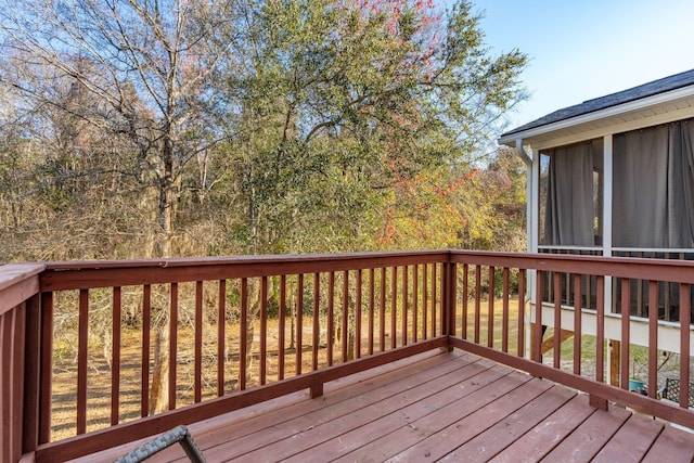 wooden deck featuring a sunroom