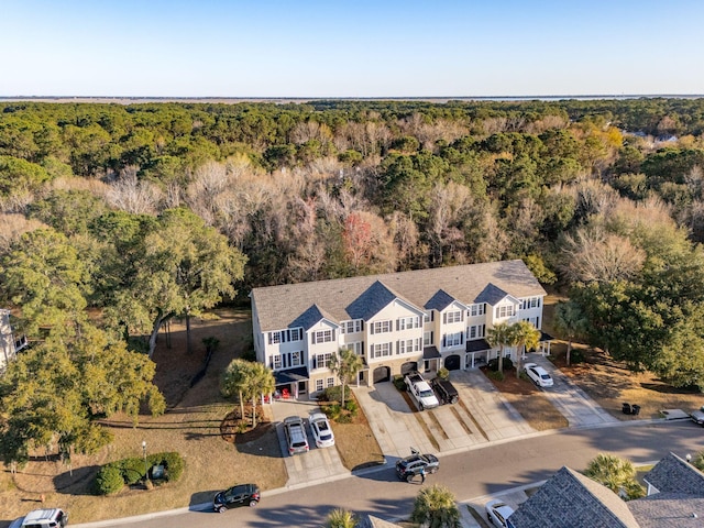 aerial view featuring a wooded view