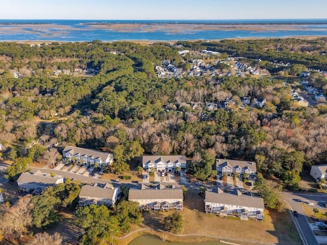 aerial view featuring a forest view and a residential view