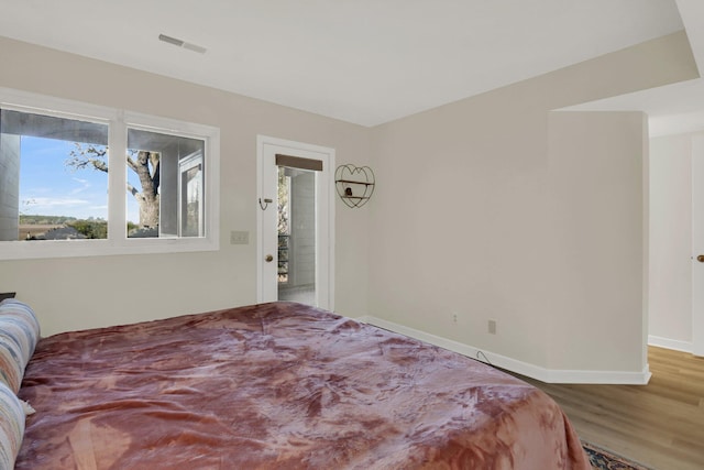 bedroom featuring hardwood / wood-style floors