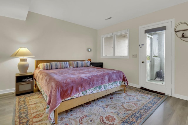 bedroom featuring light hardwood / wood-style floors