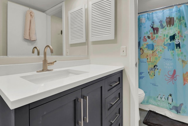 bathroom with vanity and toilet