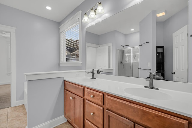 bathroom featuring walk in shower, tile patterned floors, and vanity