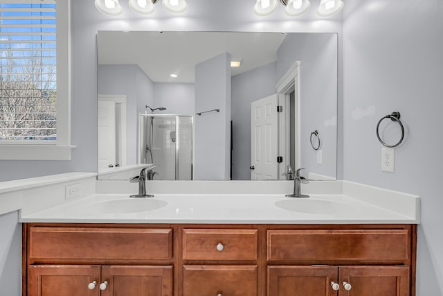 bathroom with an enclosed shower and vanity