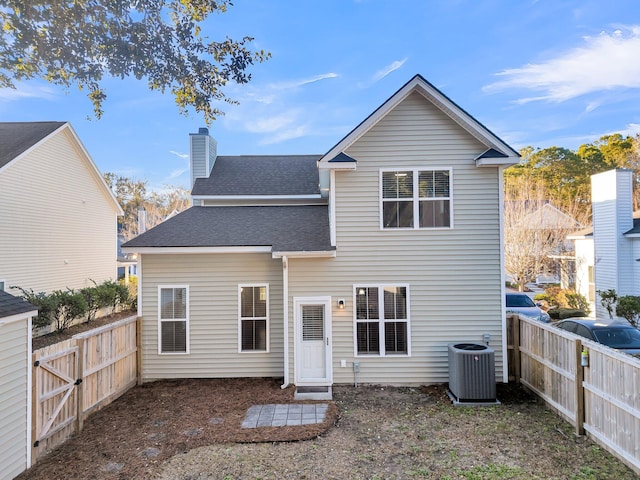 rear view of property featuring cooling unit