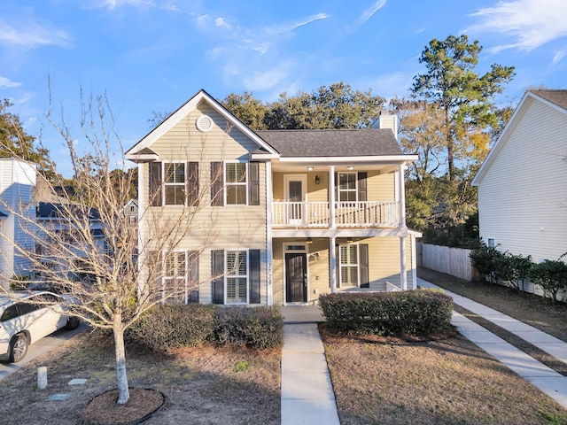 view of front of home with a balcony and a porch