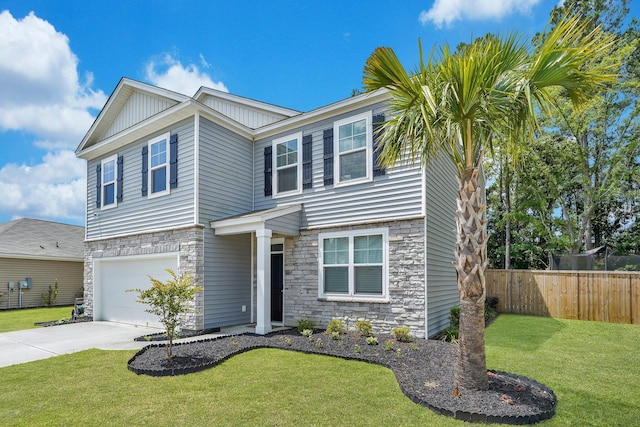 view of front of house with a garage and a front yard