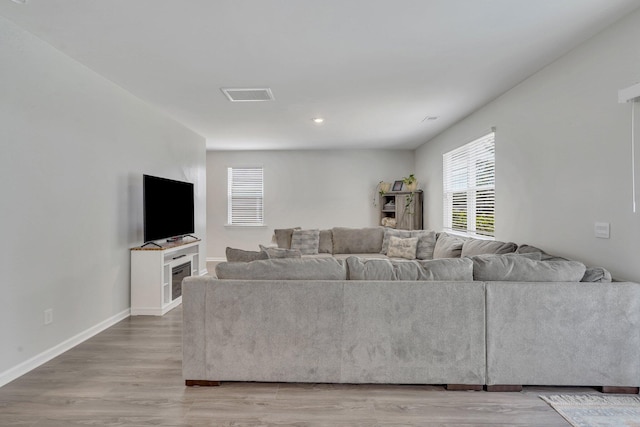 living room with light hardwood / wood-style floors