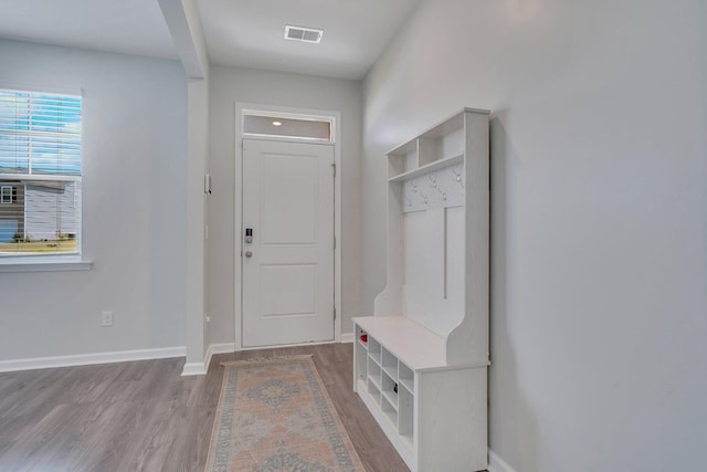 mudroom with light hardwood / wood-style floors