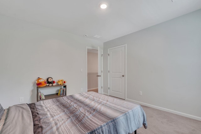 bedroom with light carpet