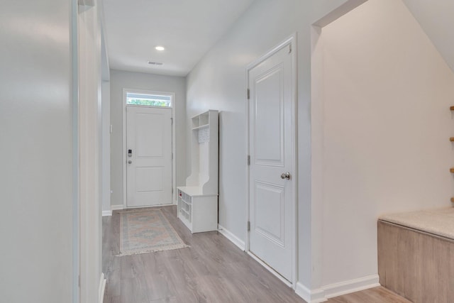 corridor featuring light hardwood / wood-style flooring