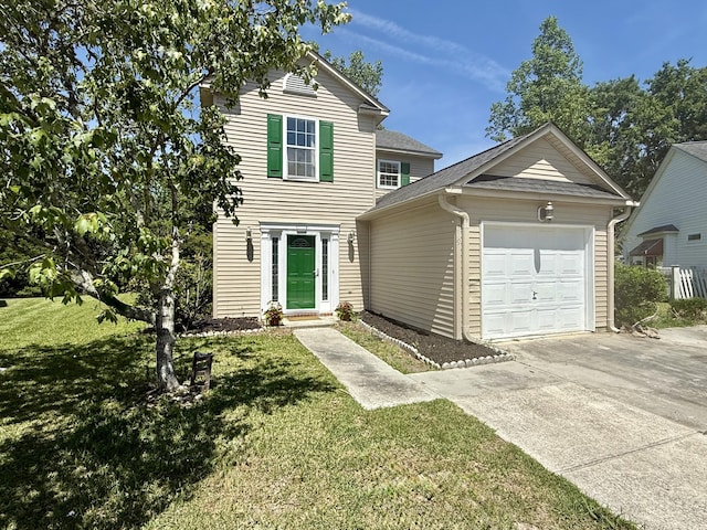 traditional home with a garage, roof with shingles, a front yard, and concrete driveway