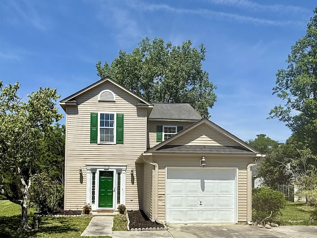 traditional home with an attached garage and driveway