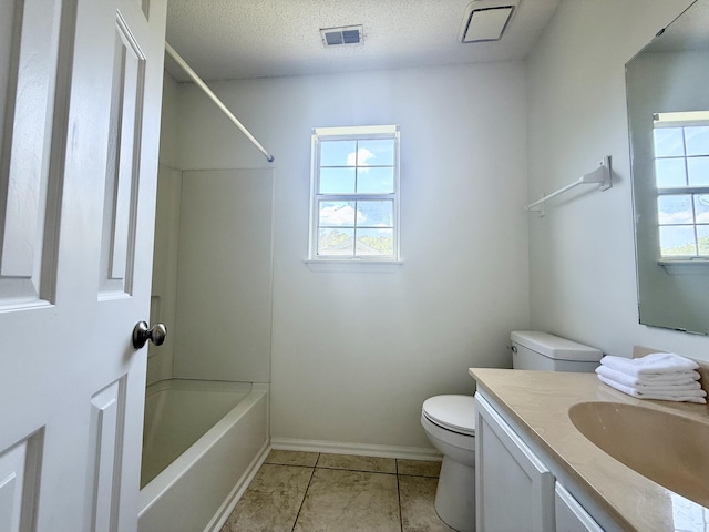 bathroom with visible vents, vanity, toilet, baseboards, and a textured ceiling