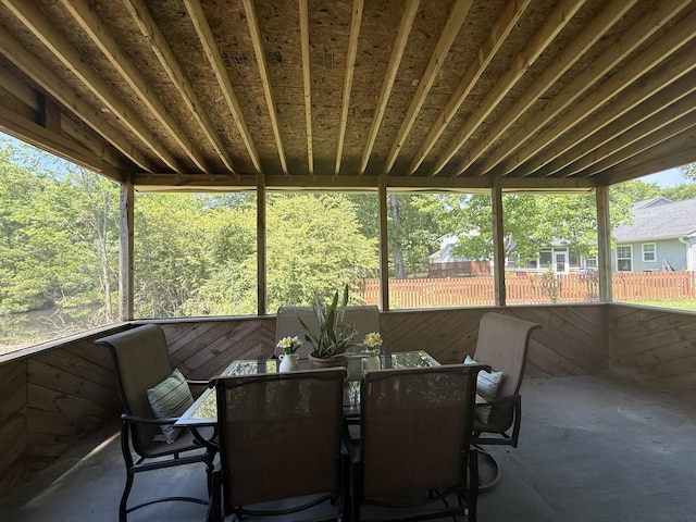sunroom / solarium with plenty of natural light and outdoor dining area