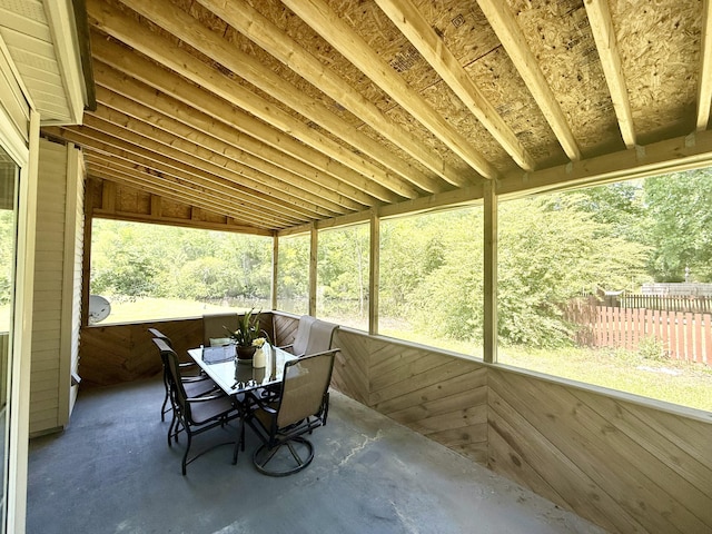 sunroom / solarium featuring outdoor dining area