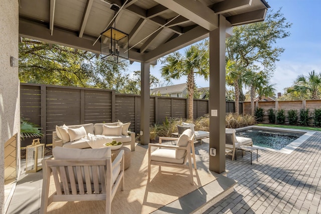 view of patio featuring an outdoor living space and a fenced in pool