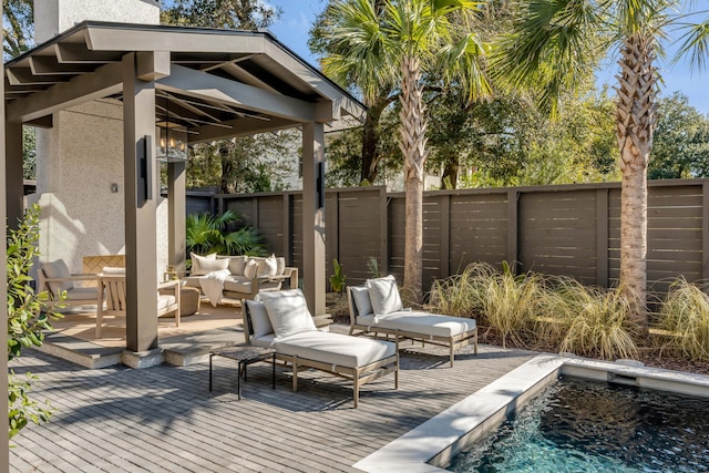 view of patio featuring an outdoor living space and a swimming pool side deck