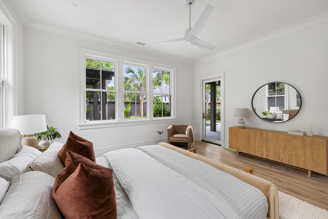 bedroom with light hardwood / wood-style flooring, access to outside, ornamental molding, and ceiling fan